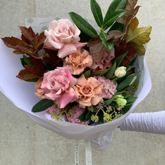 Florist Choice wrapped bouquet with pink roses, hydrangeas, tulips, and autumn foliage. A stunning Valentine's Day floral gift.