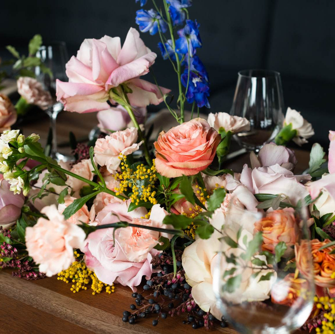 Wedding floral table arrangement in pink and pastel