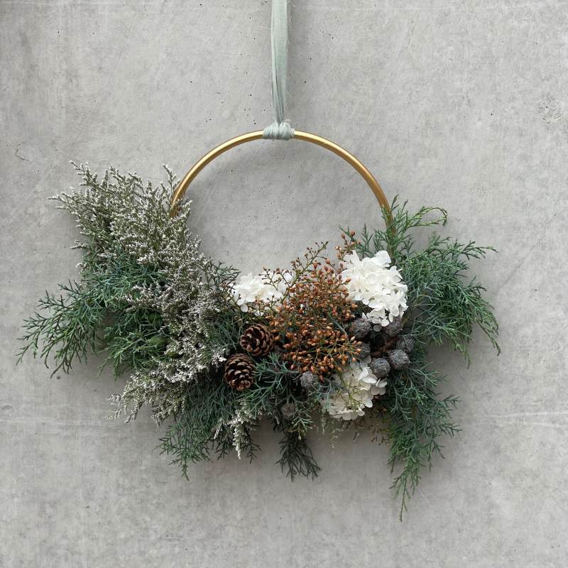 Christmas inspired wreath with pine foliage and pine cones