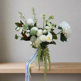 Elegant porcelain-themed floral arrangement with white hydrangeas, roses, and seasonal blooms in a tall vase. Perfect for Mother's Day flower delivery in Tullamarine.